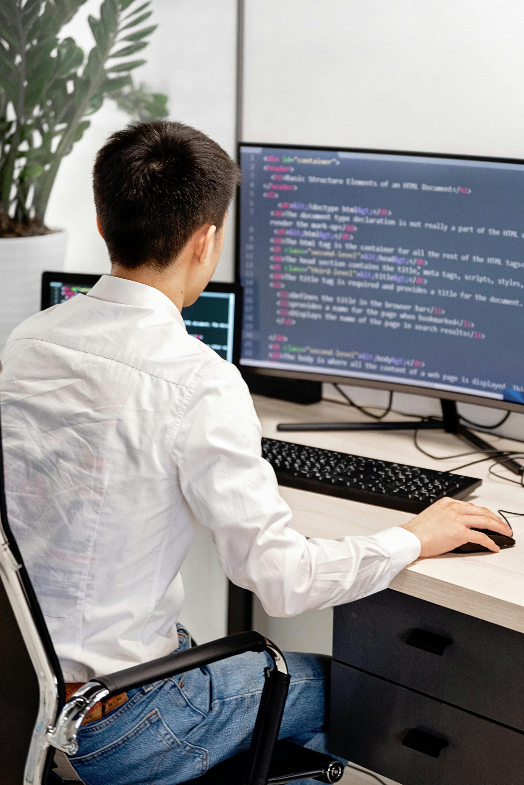 Developer working on website code at a desk