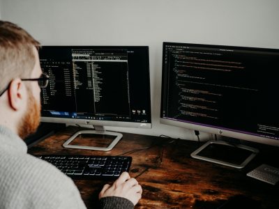Passionate About Problem-Solving Software developer writing code on a computer screen