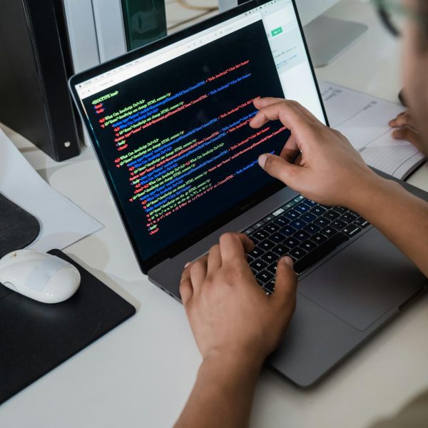 Developer coding on laptop — responsive web development